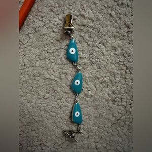 Evil eye vest or sweater clip